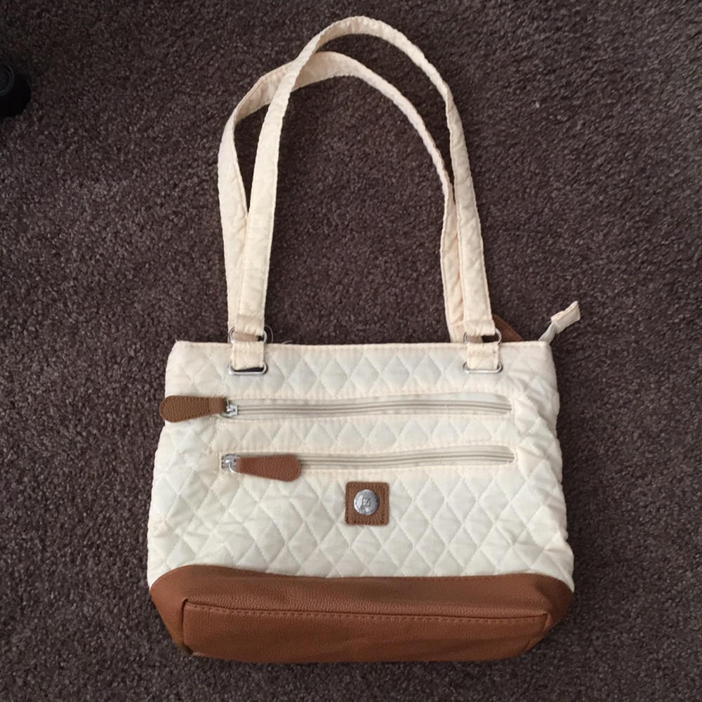 Cream and brown colored purse.